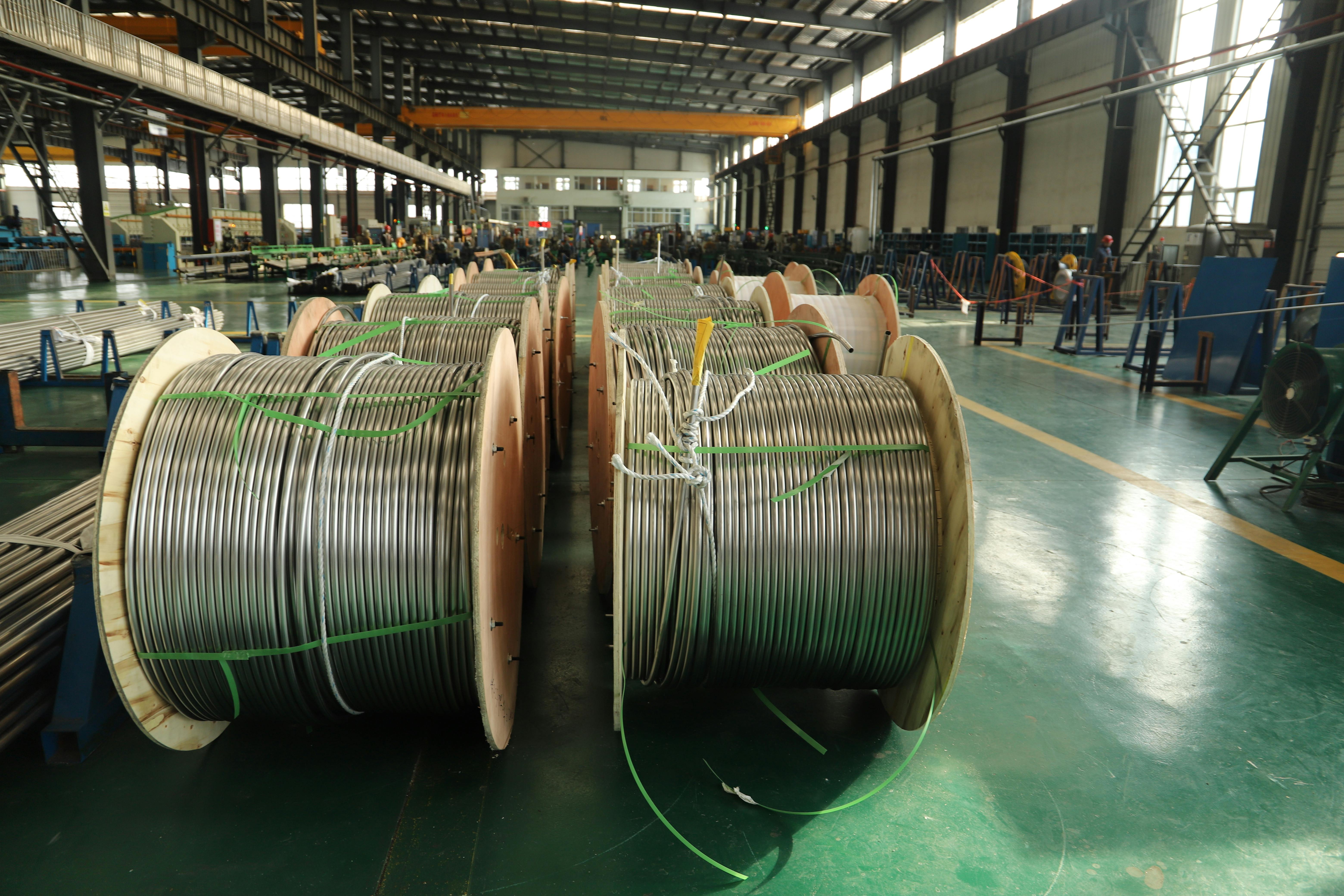 Industrial cable reels inside a manufacturing facility